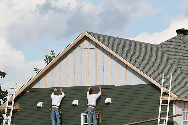 Professional Siding technician working in Junction City, OR